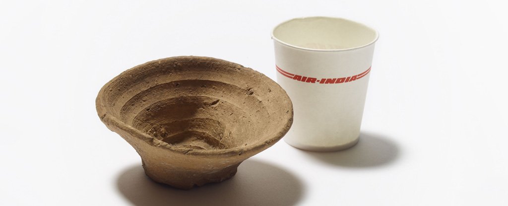 The old clay cup alongside a modern paper one. 