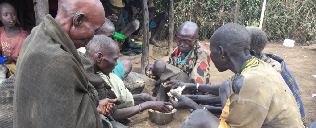 Ik women share a meal. 