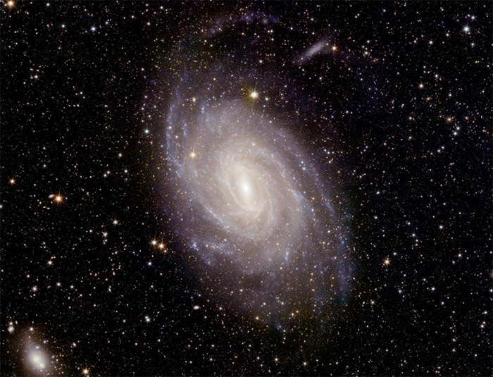 giant glowing spiral galaxy dense with copious stars