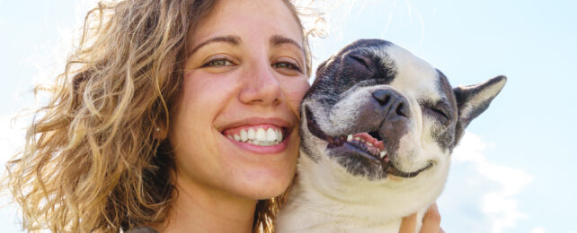 woman and happy dog