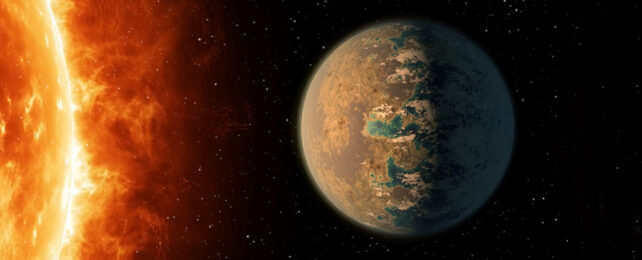 Illustration of a planet dry on one side wet on the other facing a sun