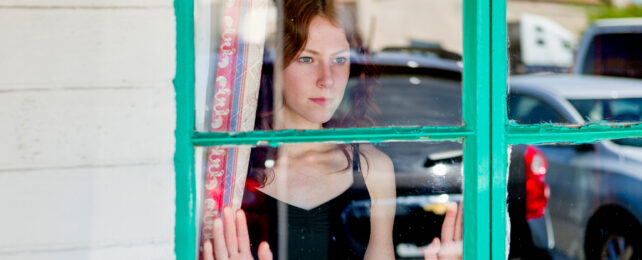 girl looking out a window