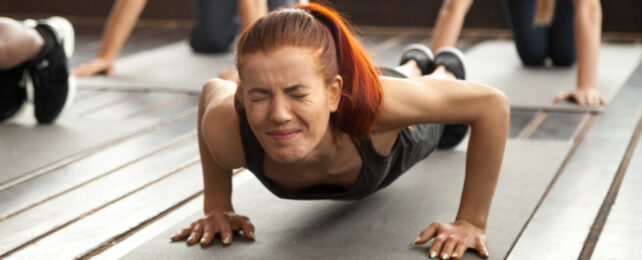 woman straining doing push up