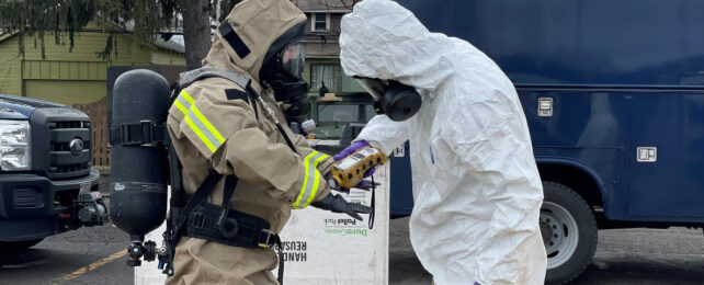 national guard in protective suits