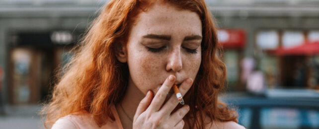 red haired teen smoking