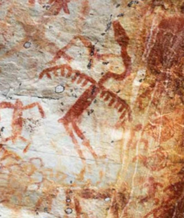 Ochre cave painting of winged snake with human legs