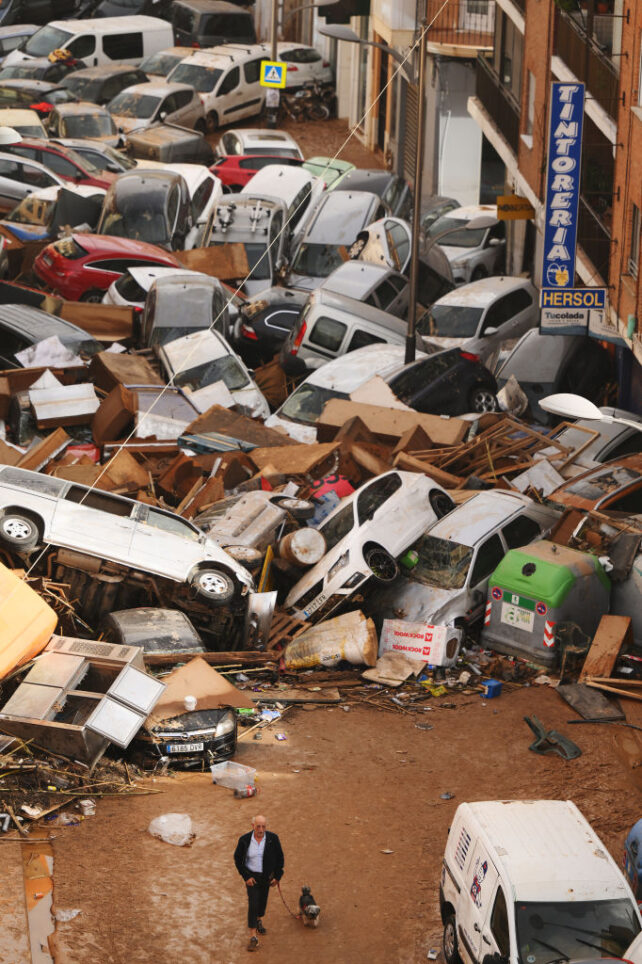 VALENCIA, SPAIN - OCTOBER 30: Cars are piled in the street with other debris after flash floods hit the region on October 30, 2024 in the Sedaví area of Valencia, Spain. Spanish authorities said on Wednesday that at least 62 people had died in the Valencia region overnight after flash-flooding followed heavy rain. Spain's meteorological agency had issued its highest alert for the region due to extreme rainfall. (Photo by David Ramos/Getty Images)