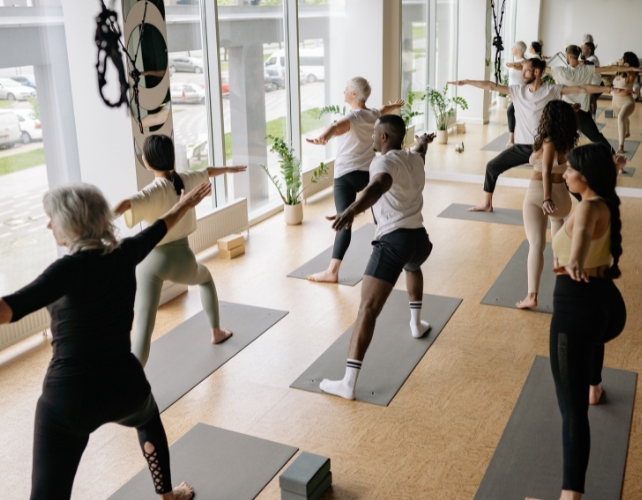 A yoga class in a naturally lit room