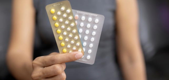 Packets of pills in a hand