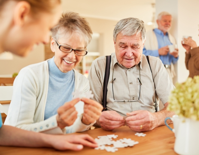 Senior couple completing a jigsaw