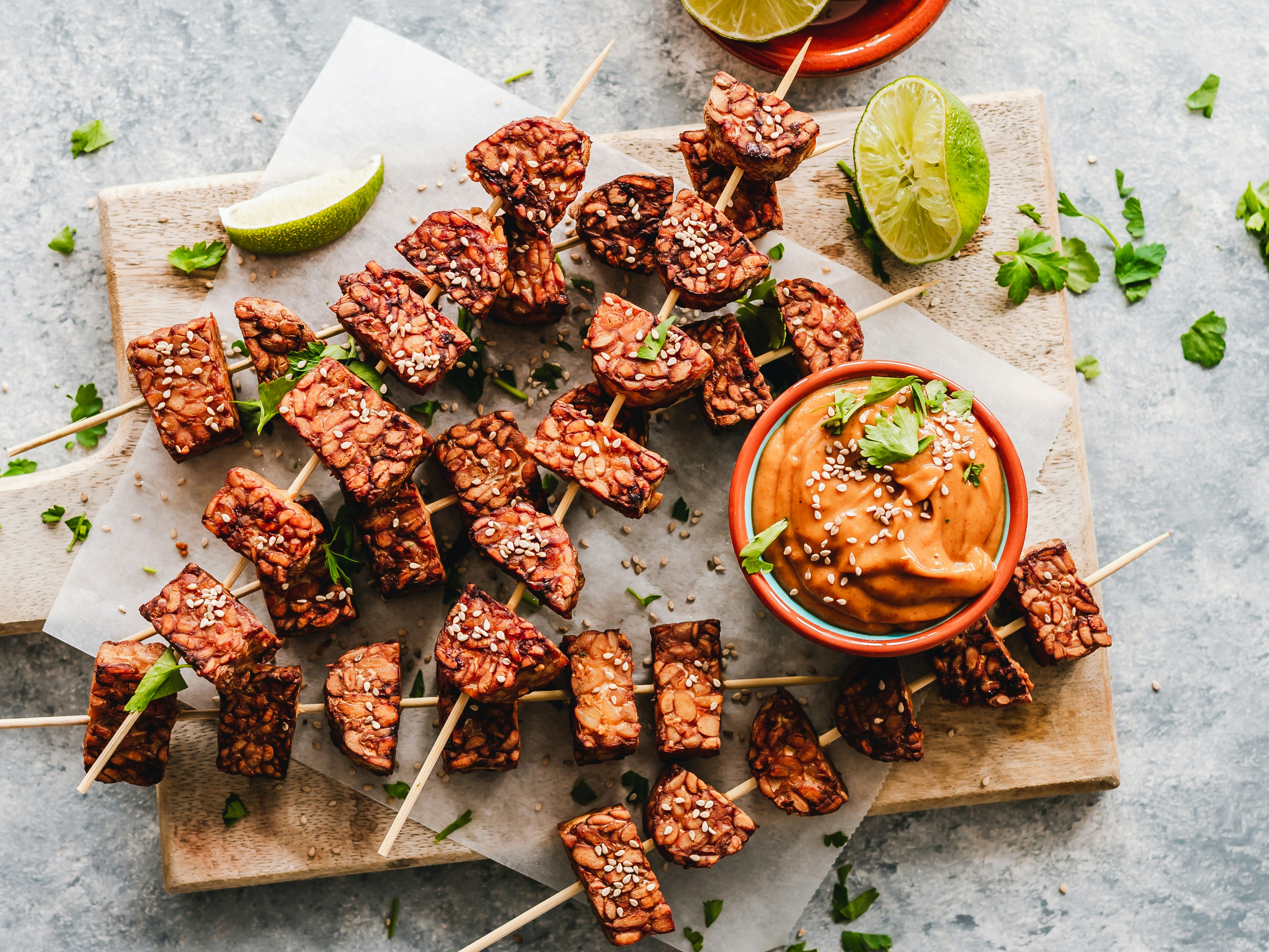 Barbecue sesame tempeh skewers with peanut sauce