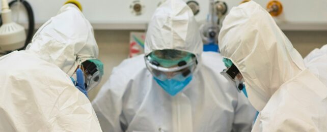 Three people in scrubs