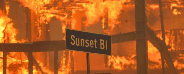 A street sign engulfed by fire