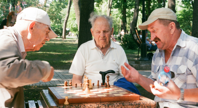 men being social playing chess