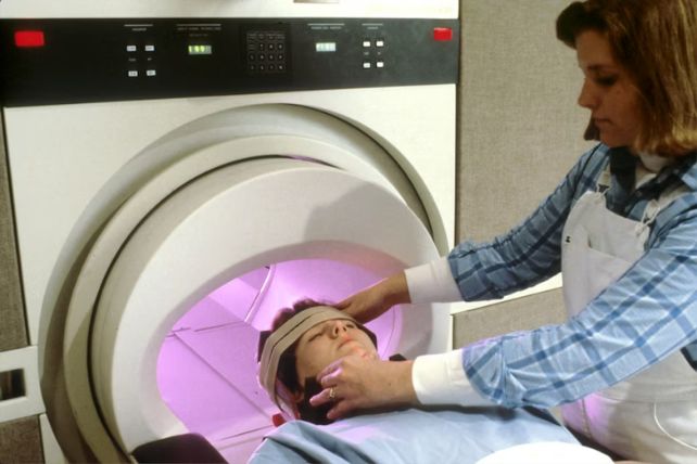 Person being prepared for a scan in an MRI machine