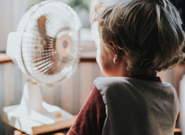 boy looking at fan