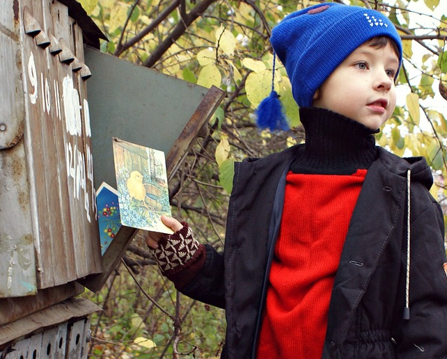 child with card