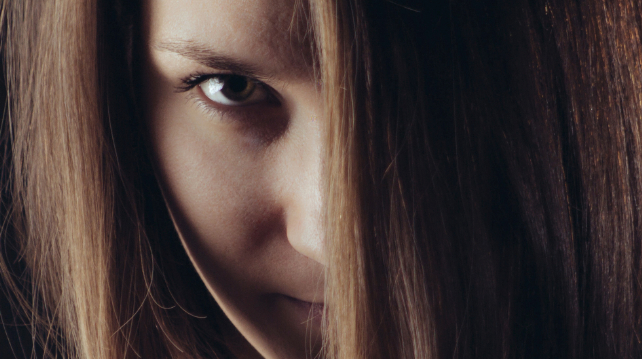 woman hiding behind her fringe