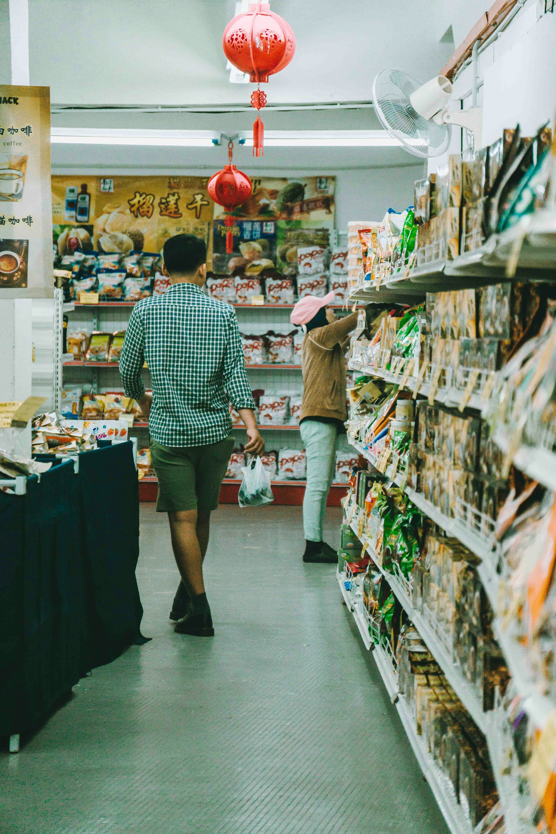 Asian supermarket with two people in the aisle