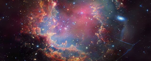 Colorful clouds of gasses surrounding a dense burst of stars