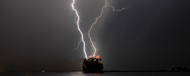 lightning over a ship at night