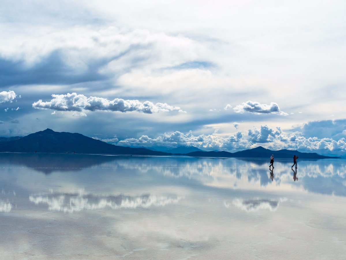 during-the-wet-season-the-salar-de-uyuni-salt-flats-in-bolivia-are-covered-in-a-thin-layer-of-water-creating-surreal-reflections-of-the-sky